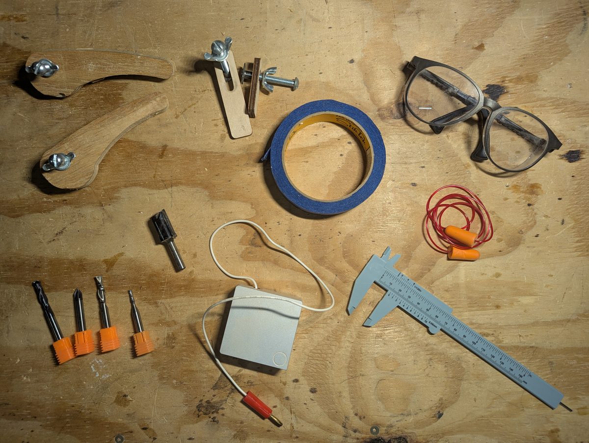 Essential CNC router accessories laid out on workbench