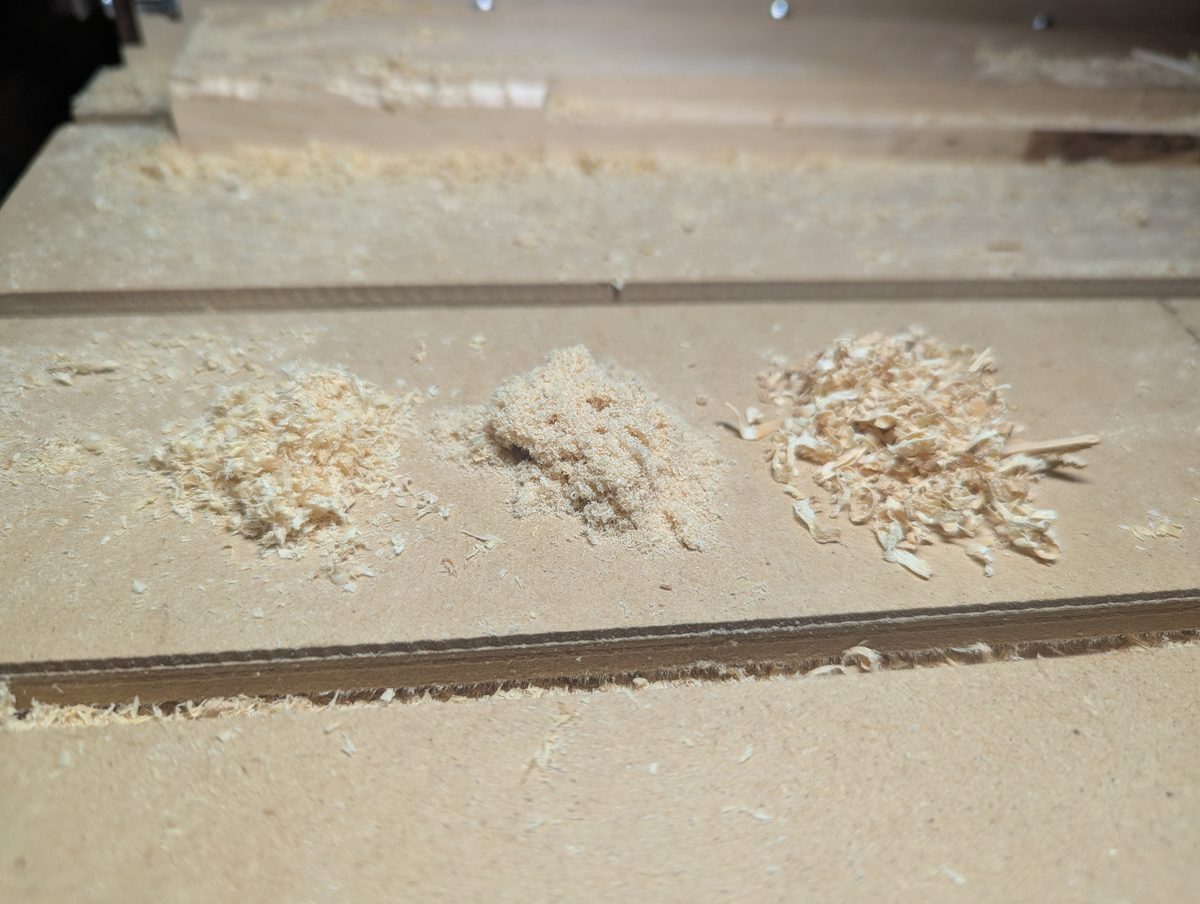 Good CNC chips vs fine dust vs large chunks side by side