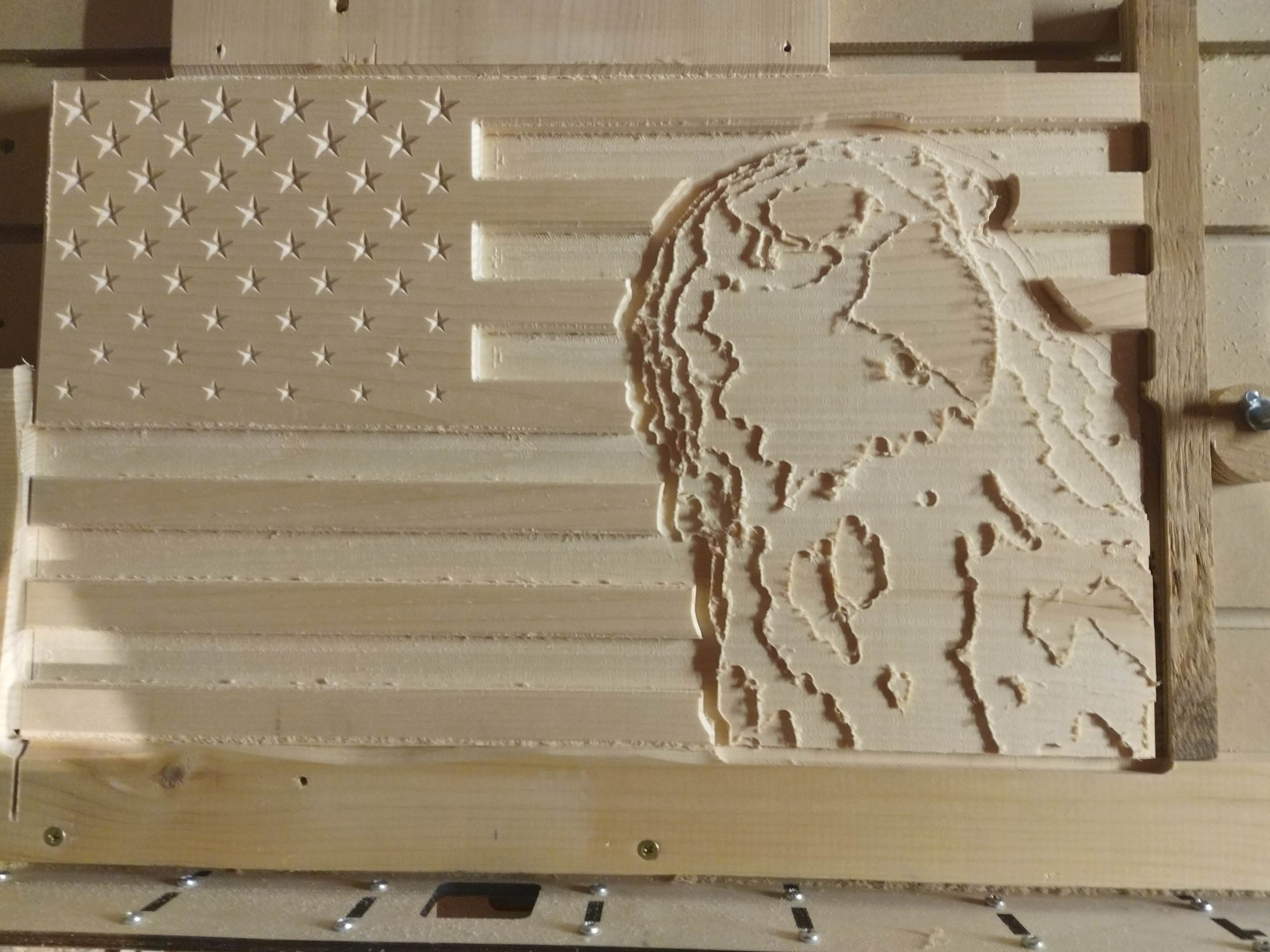 CNC-carved American flag with relief portrait — a real project from our workshop